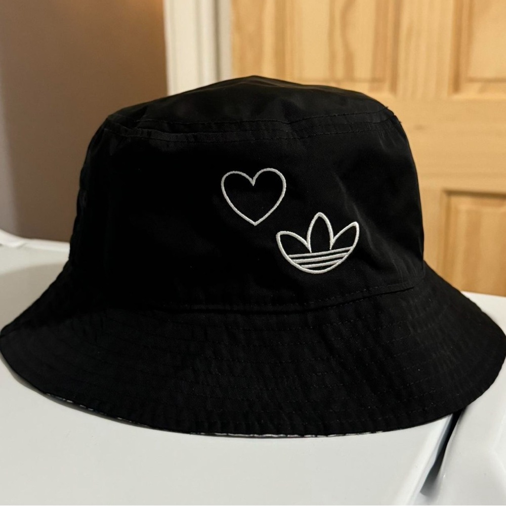 Adidas originals bucket hat with reversible floral and solid black design